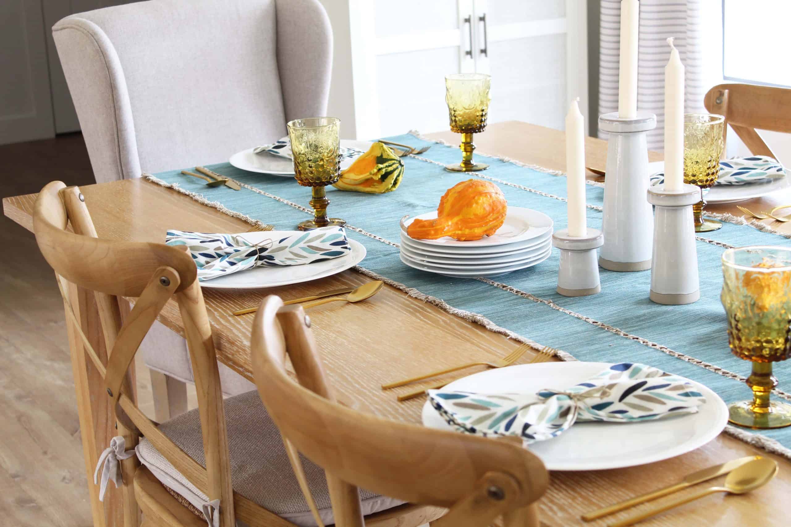 target warwick cabinet, large farmhouse table, modern candlesticks, aqua table runner