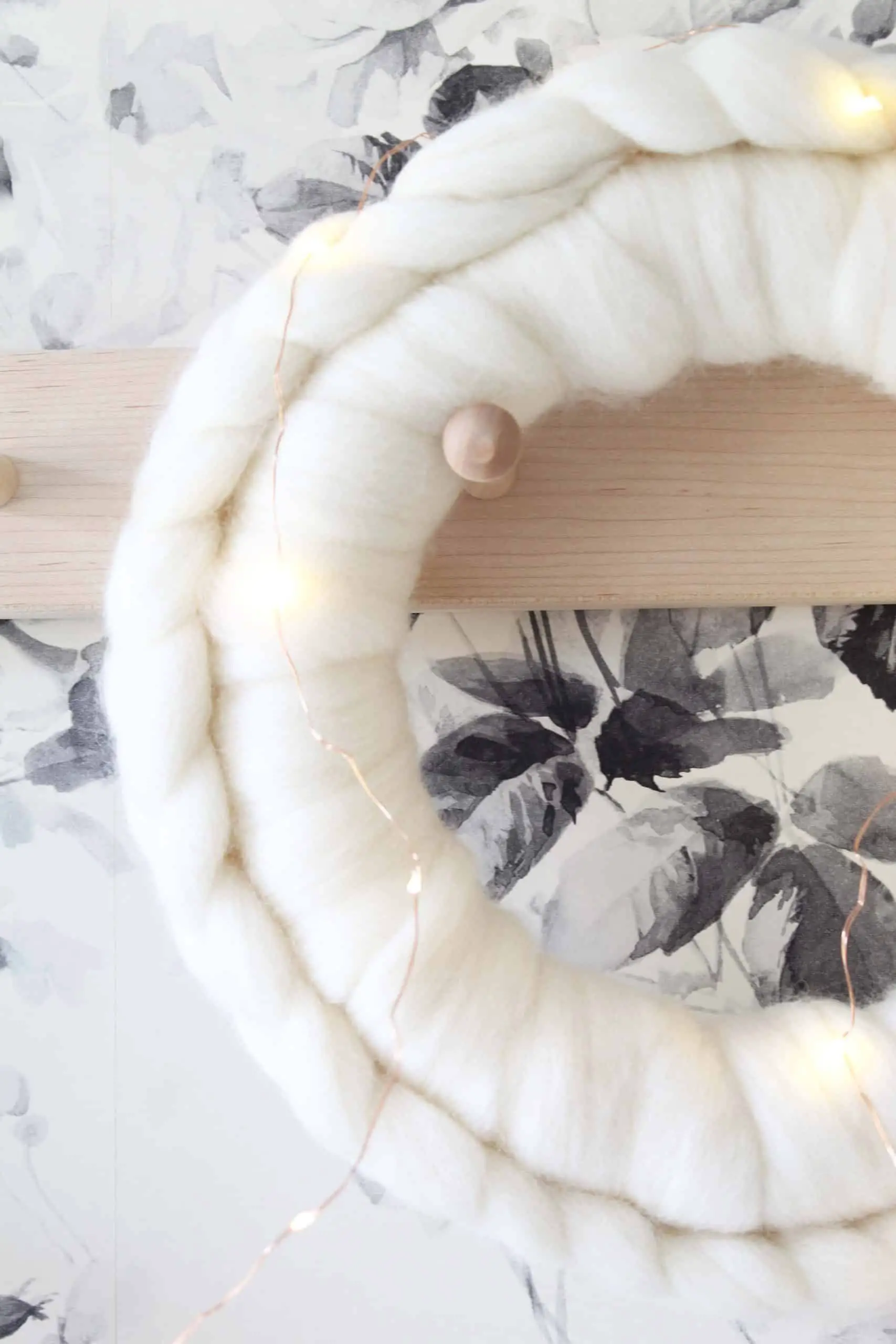 chunky wool braided wreath, anthropologie black and white floral wall paper