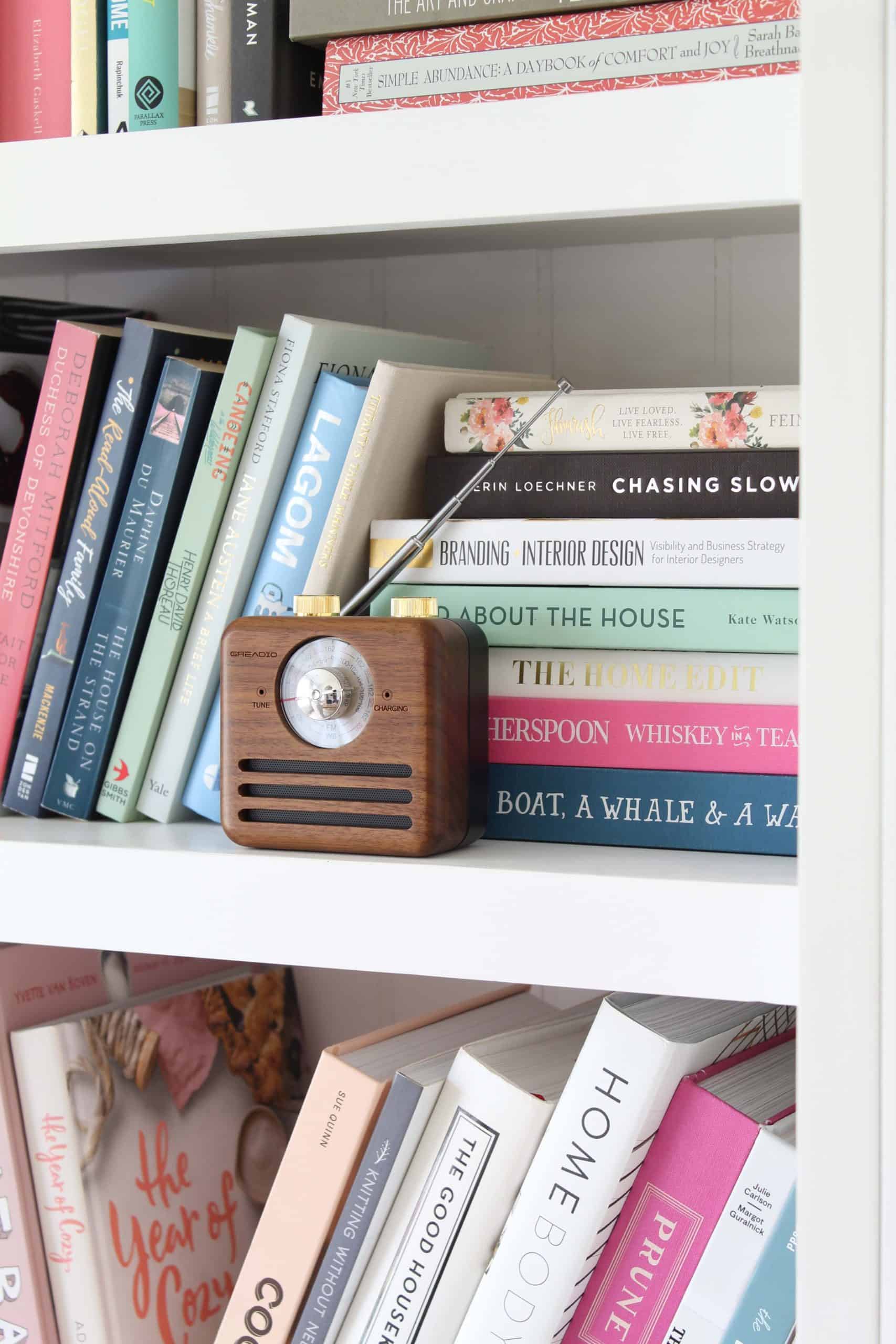 retro bluetooth speaker, bookshelf with colorful book stack