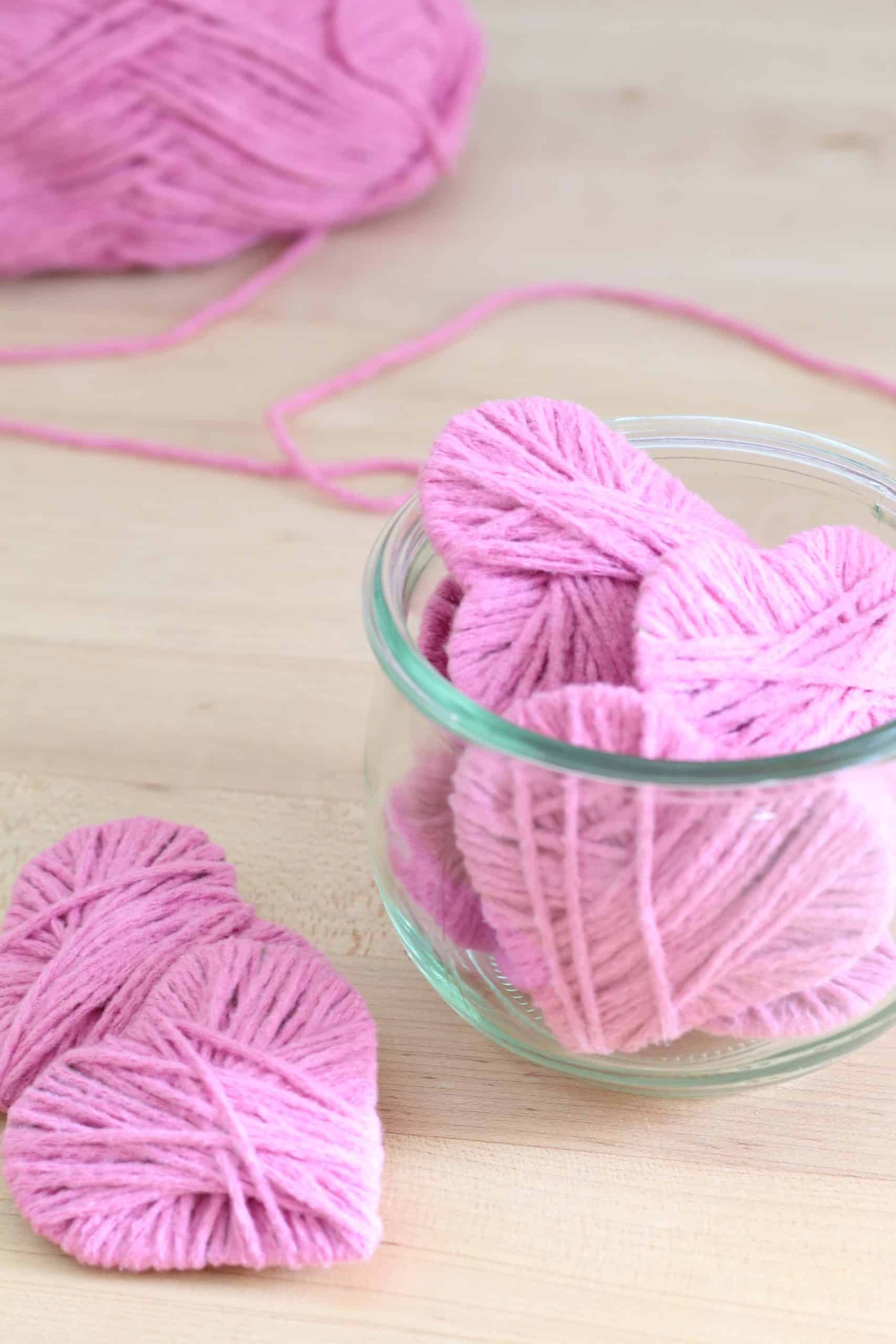 pink valentines day yarn hearts in glass jar