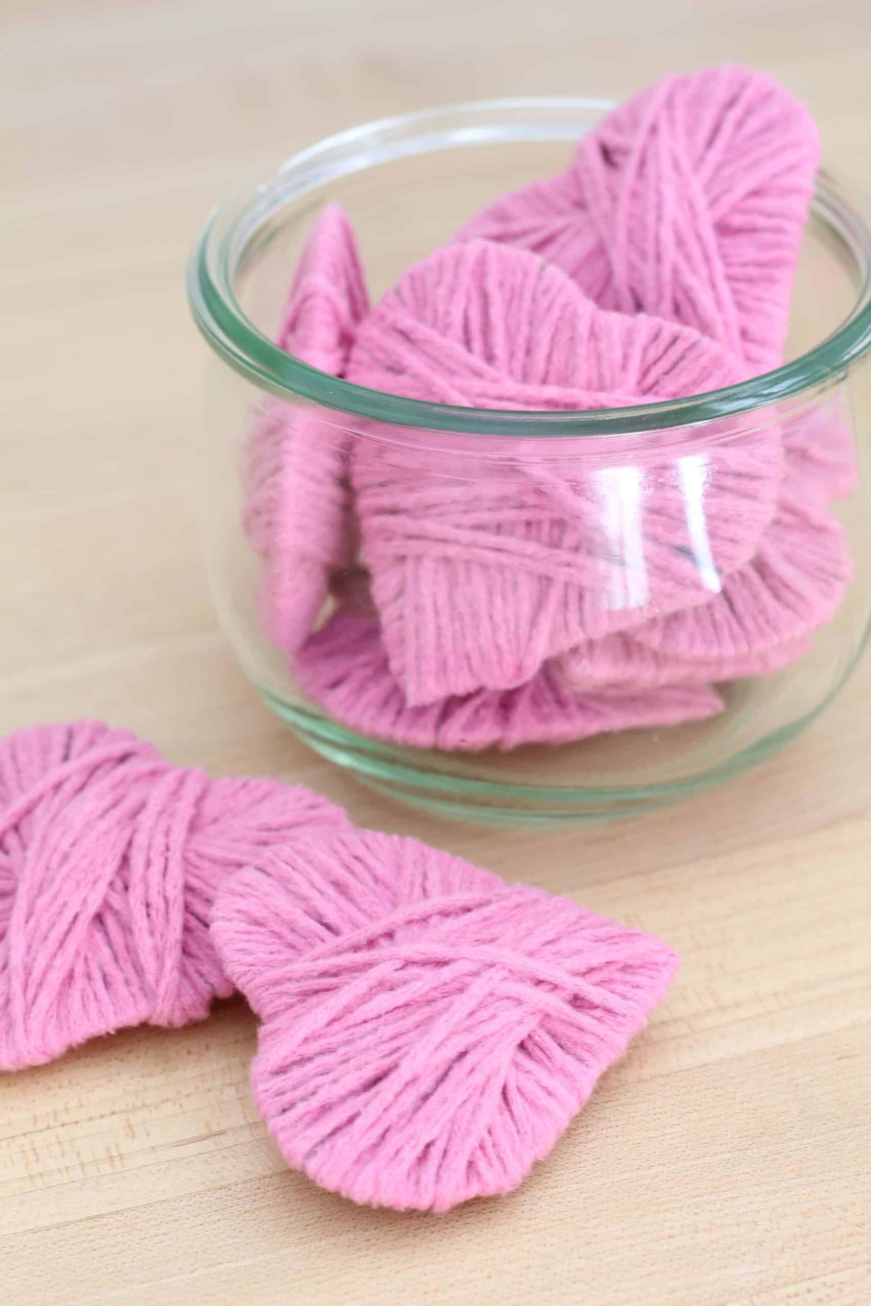 pink yarn hearts in glass jar