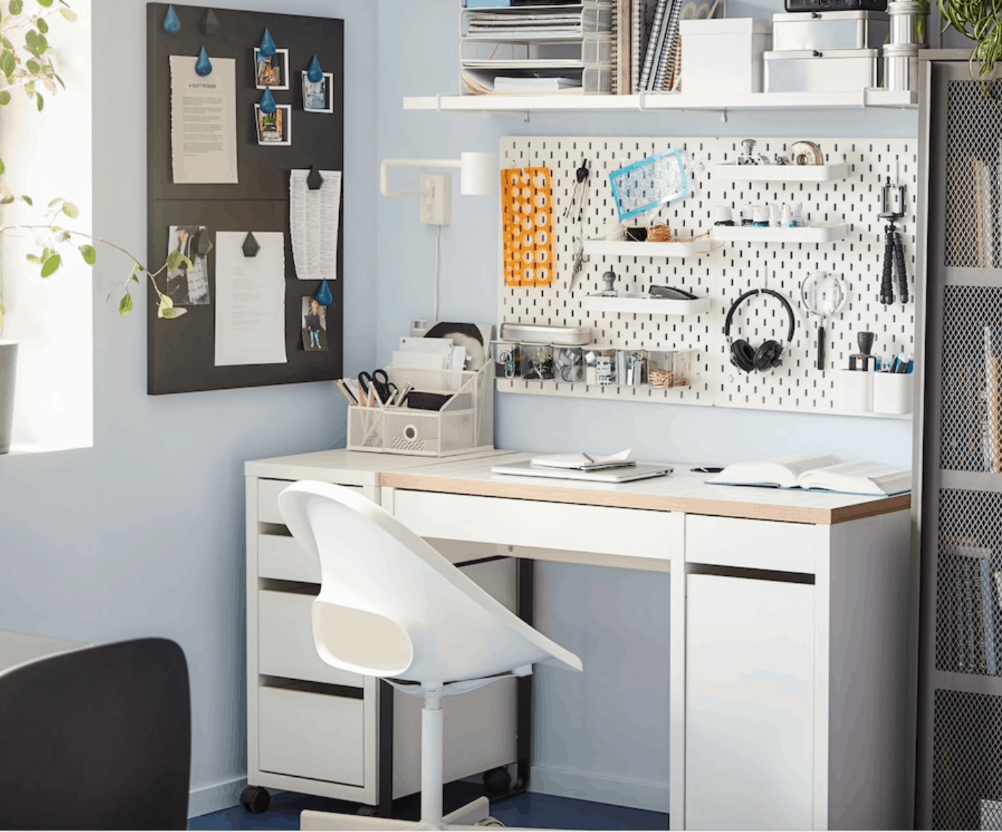 home office with pegboard above desk