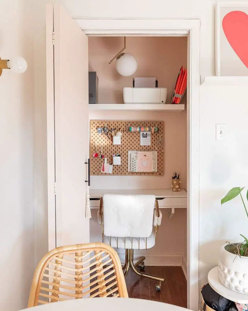 small home office in pink painted closet 