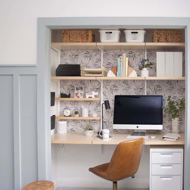 small home office in closet with floral wallpaper