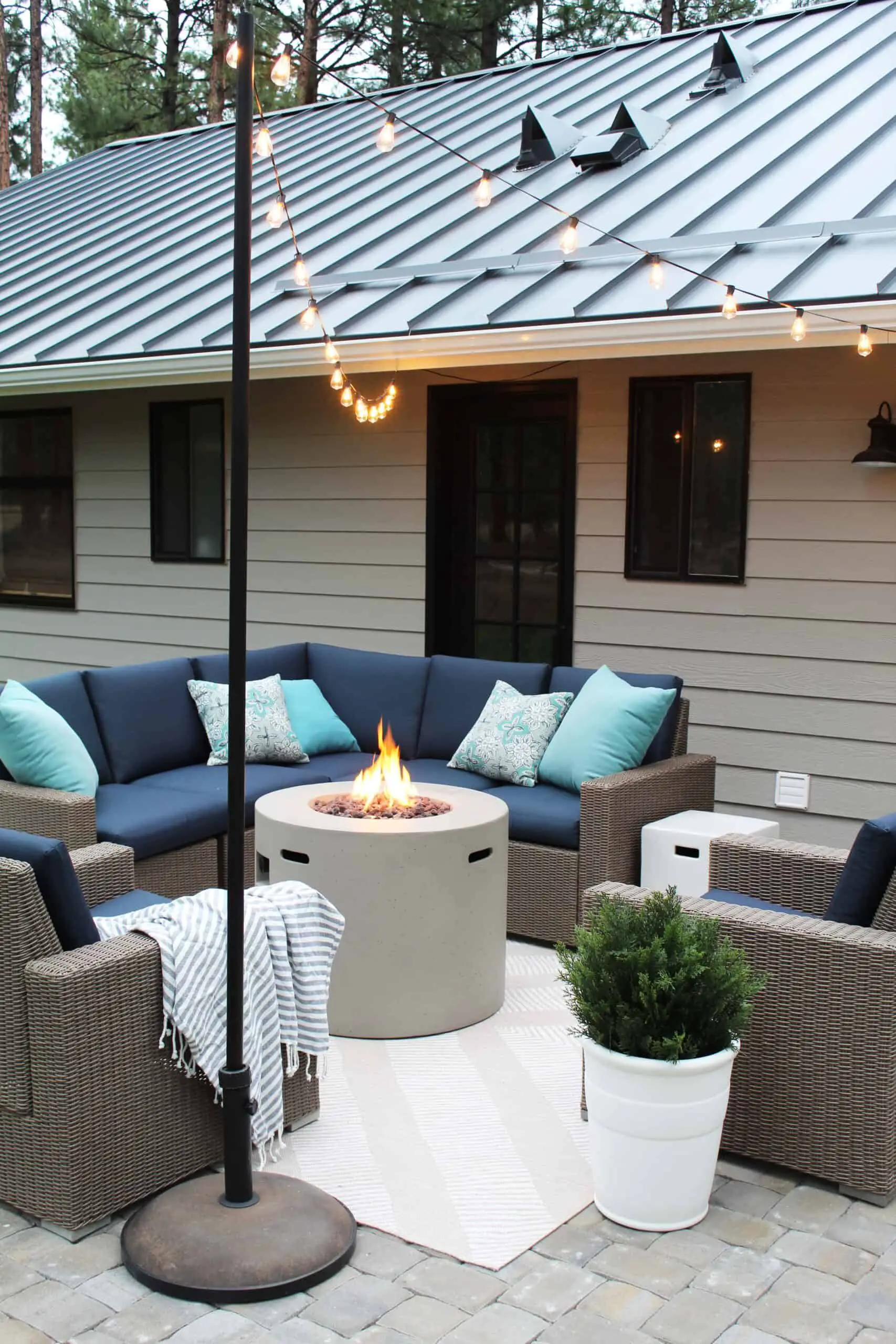 how to add string lights to your patio, target wicker outdoor furniture set, round cement fire pit