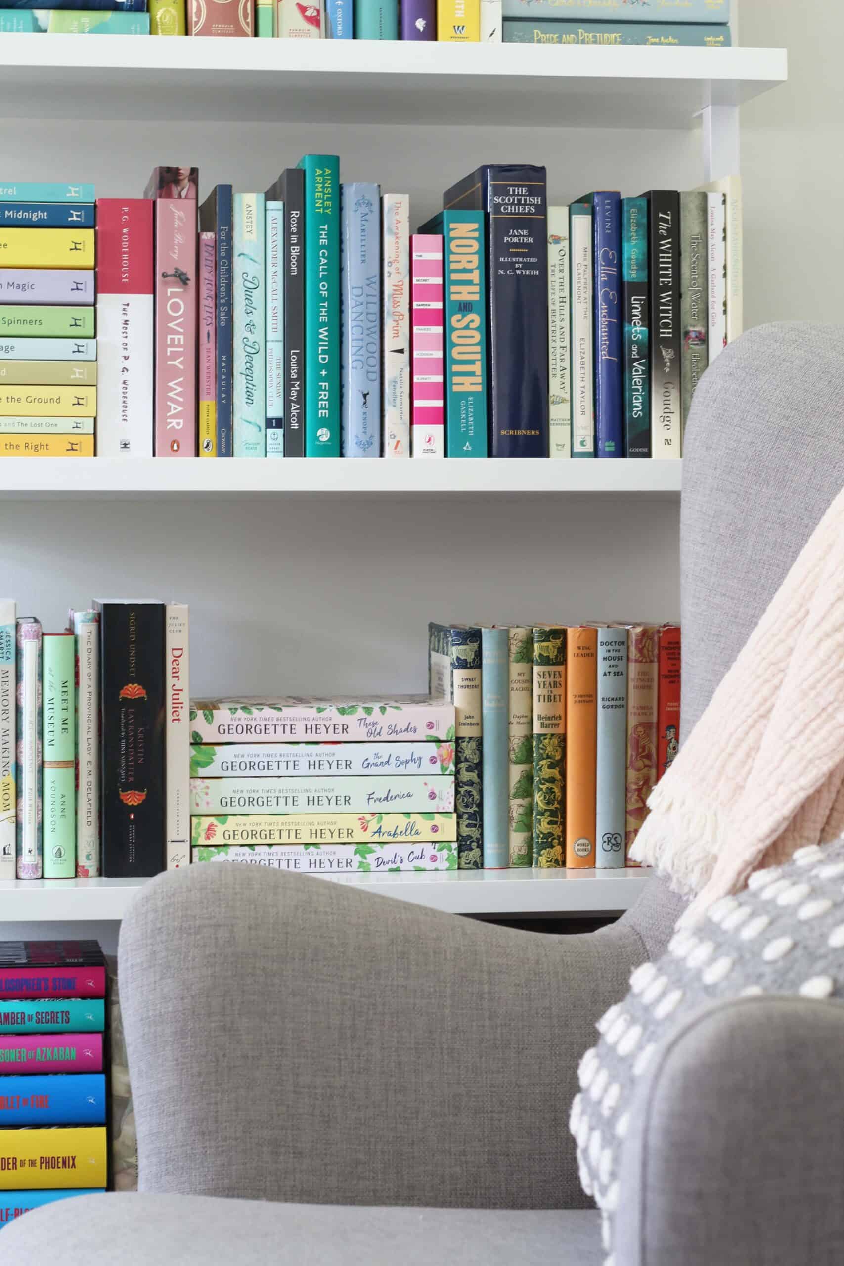 gray chair and ladder bookshelf with polka dot pillow