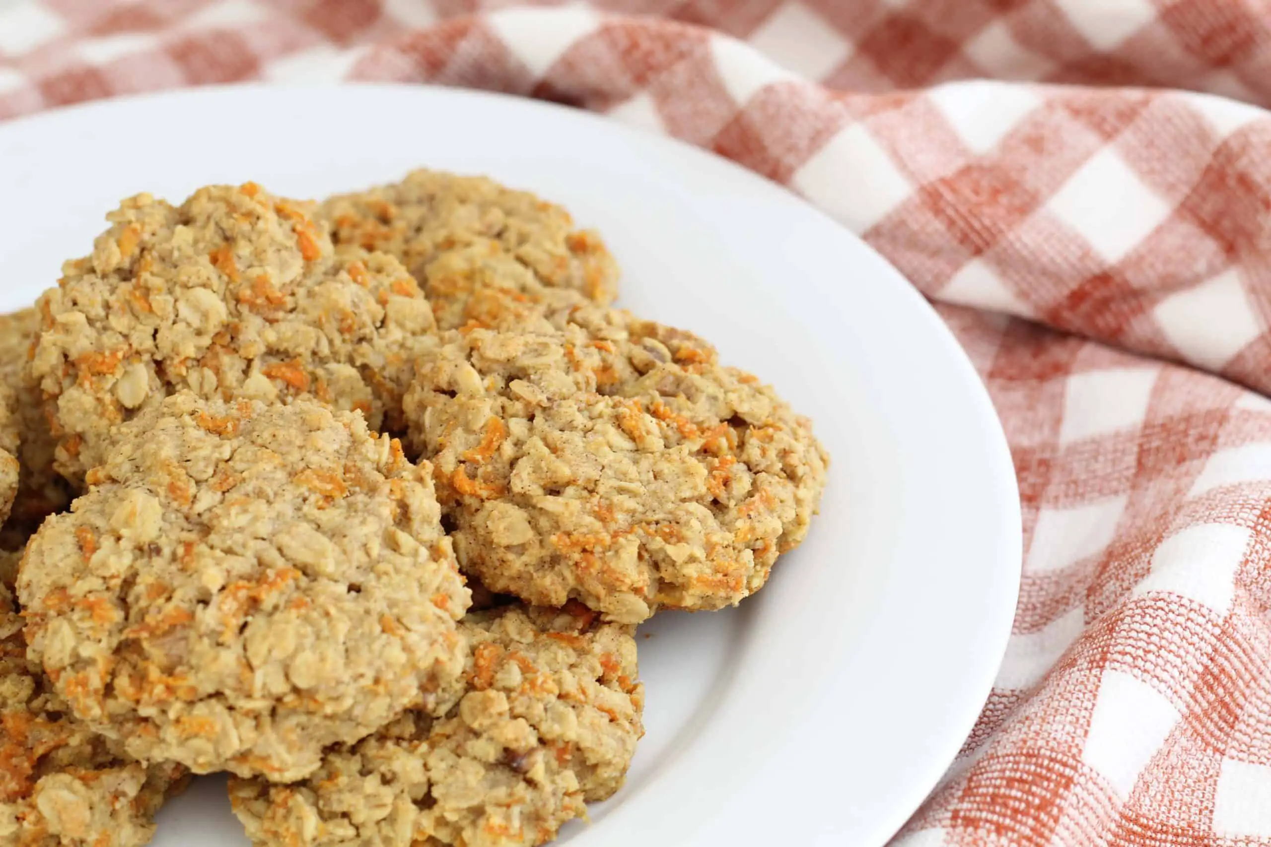 gluten free carrot cake cookies on a white plate