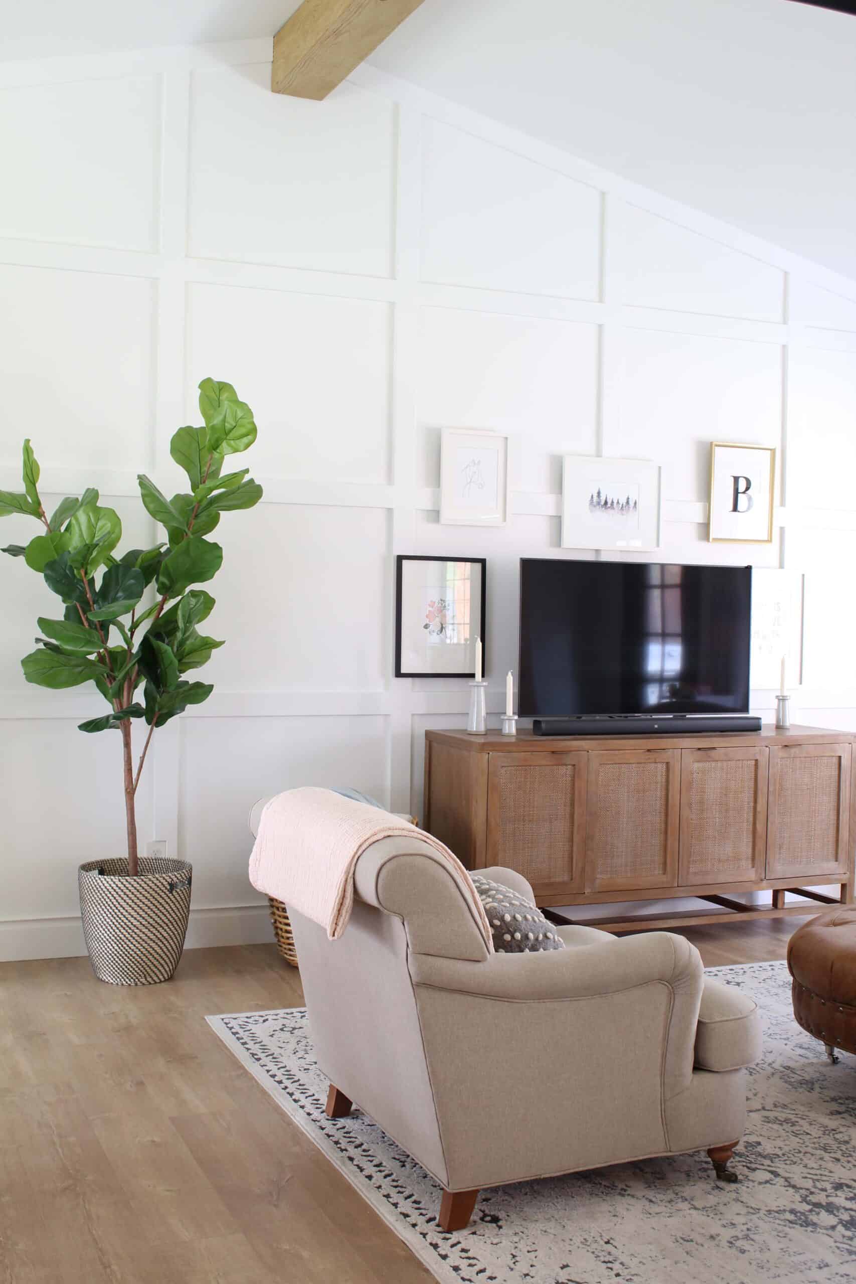 vaulted ceiling with box trim moulding on wall, board and batten accent wall