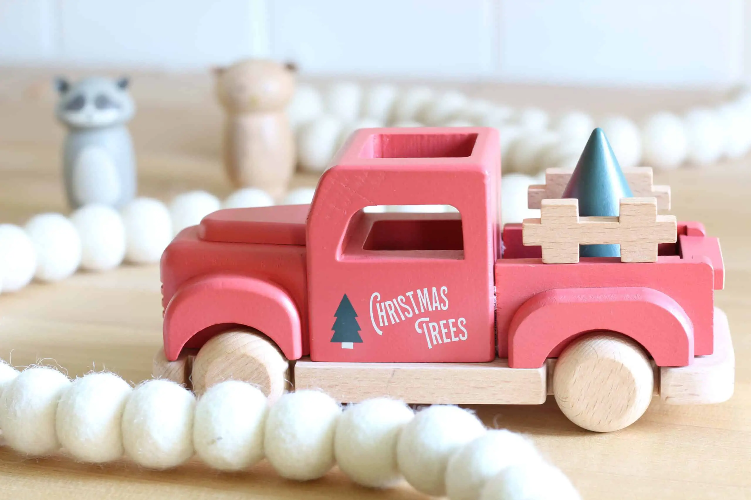 red toy vintage christmas truck with tree