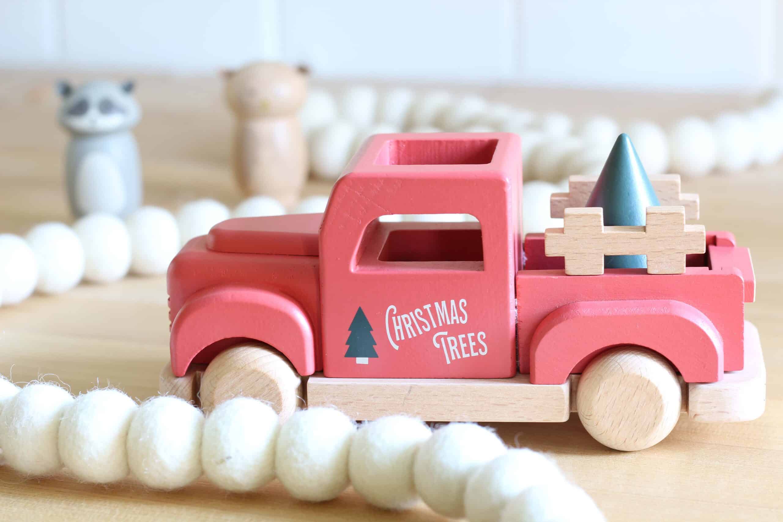 red toy vintage christmas truck with tree