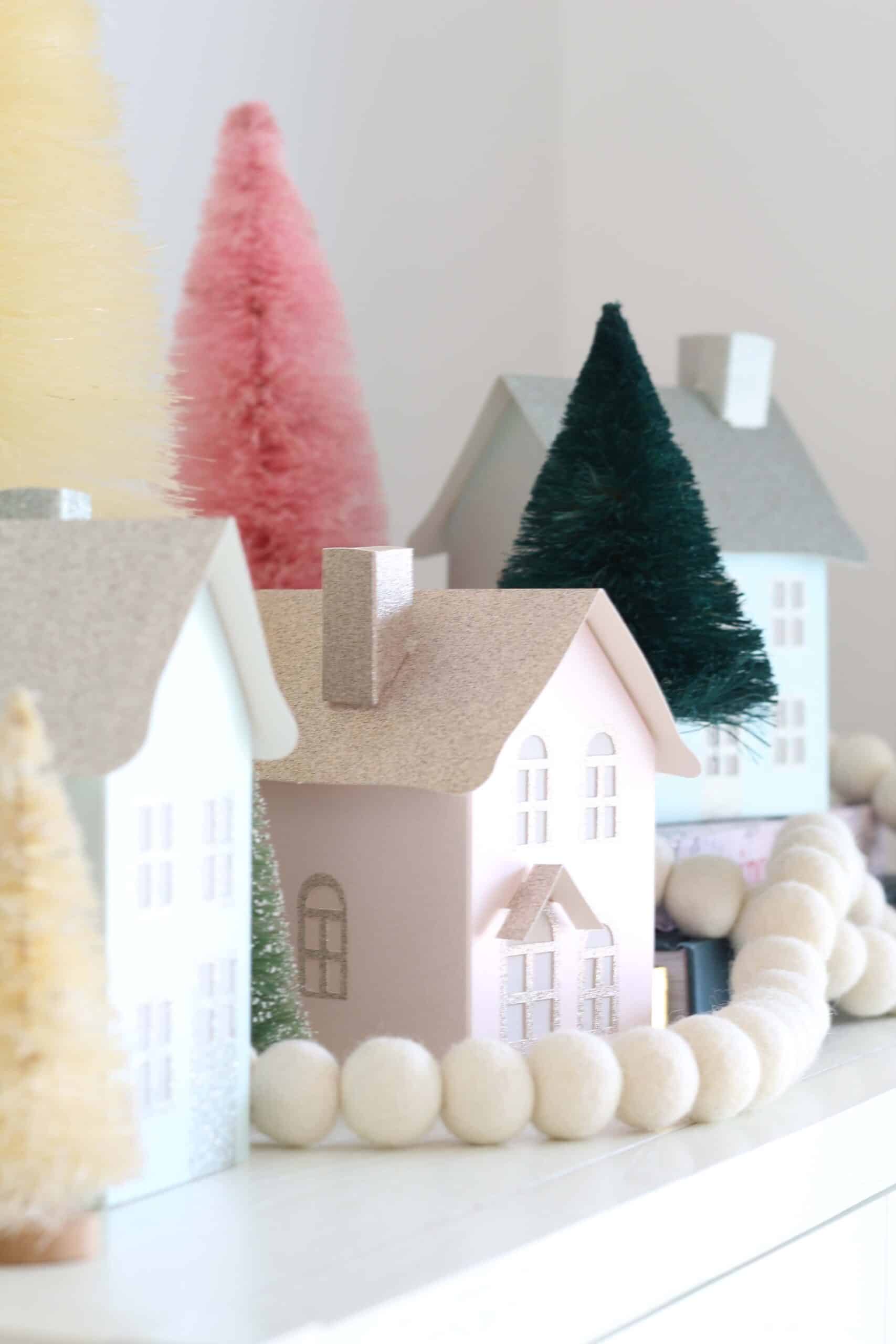 paper christmas village houses and bottle brush trees