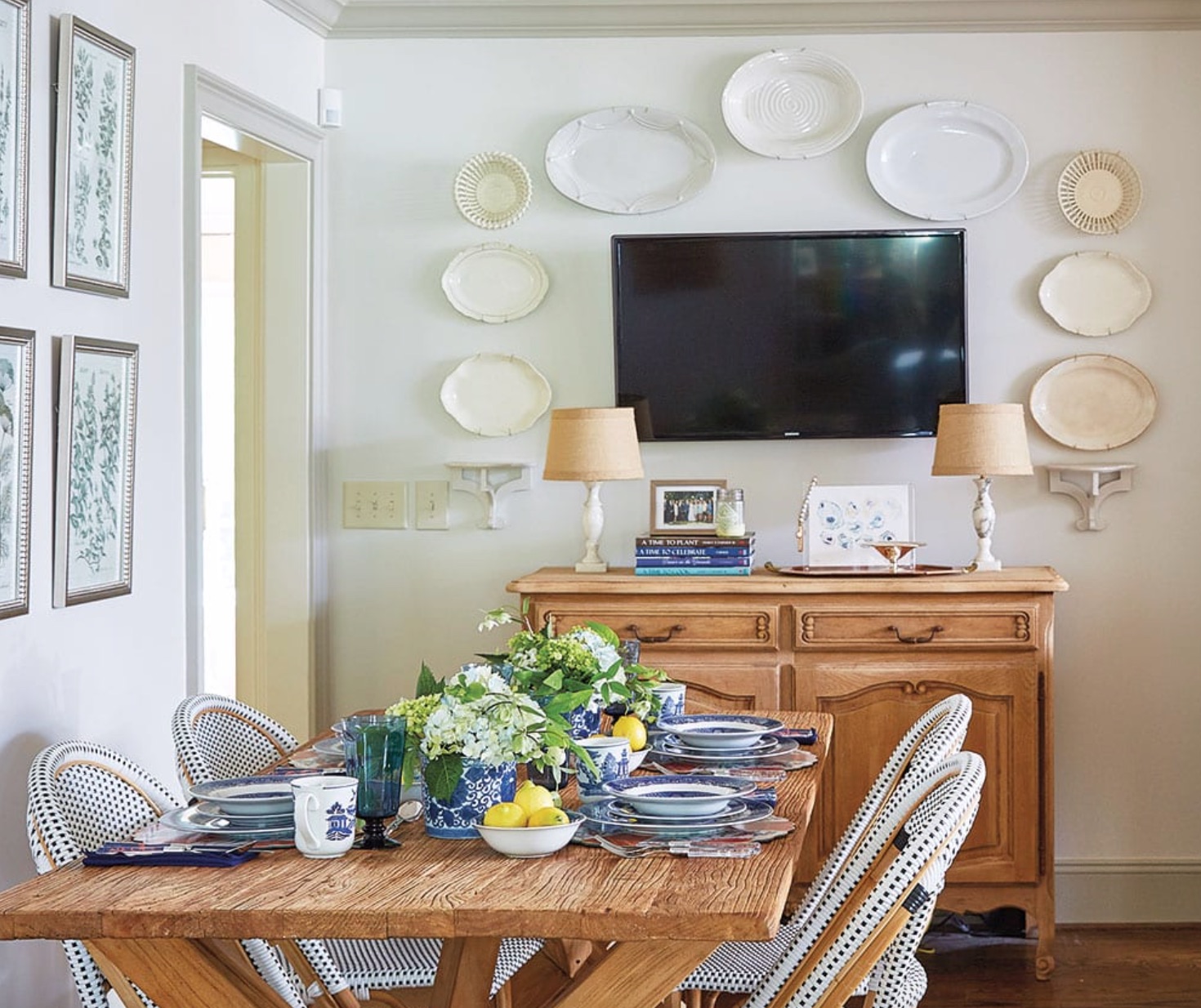 gallery wall with ironstone plates around TV, bleached pine dresser